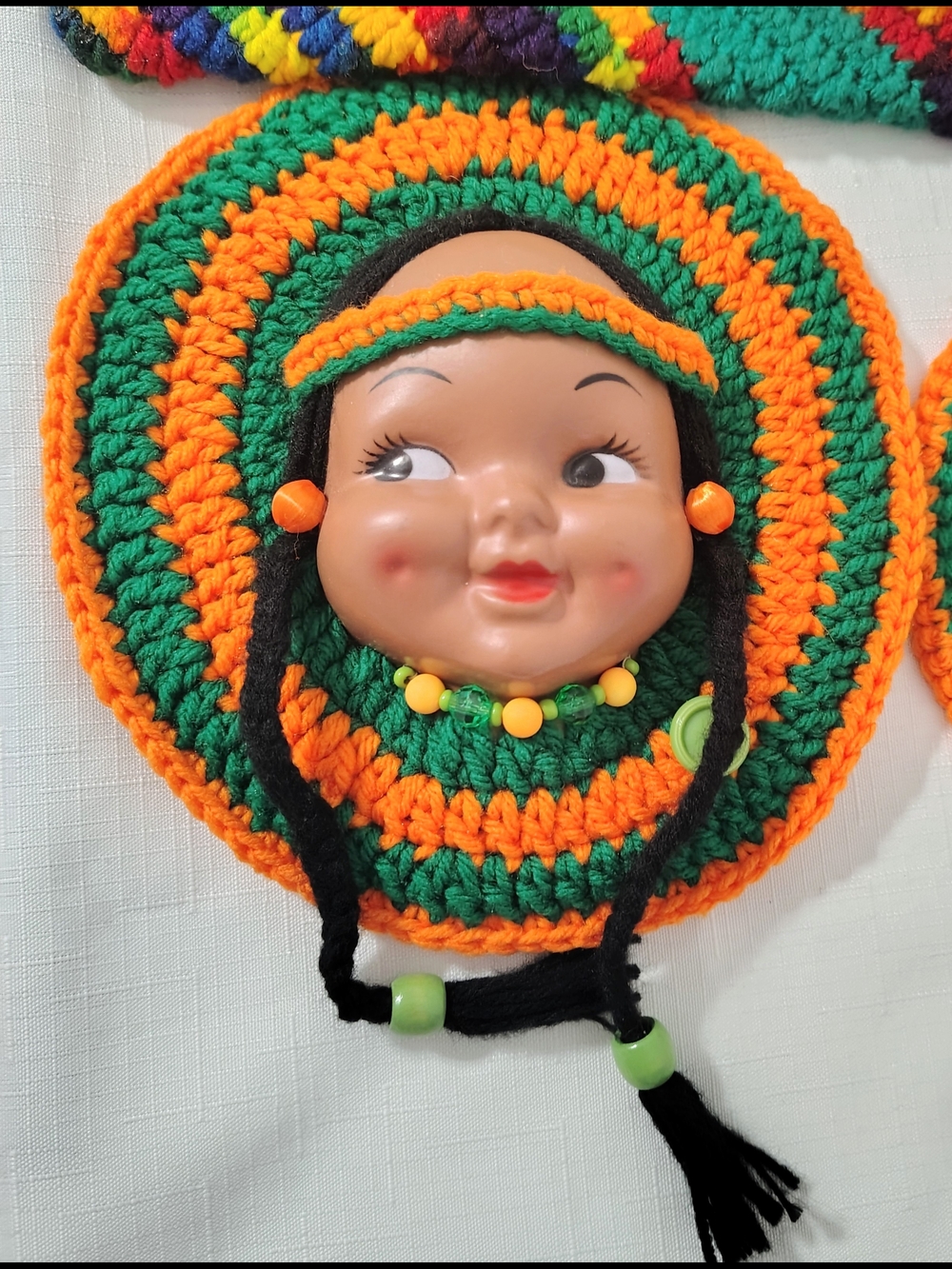 Handmade Crochet Doll Face Wall Accent in Green and Orange
